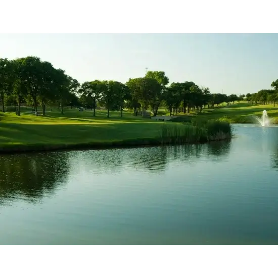 Scenic Kickingbird golf course in edmond, ok, view with pond and fountain.