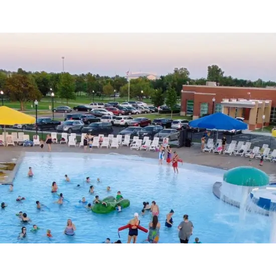 Aquatic center at Wild Horse Park in Mustang, OK with families and children swimming.