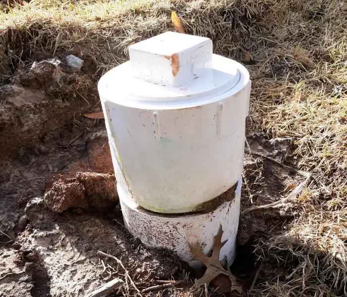 800x600 White PVC pipe in dug-up ground