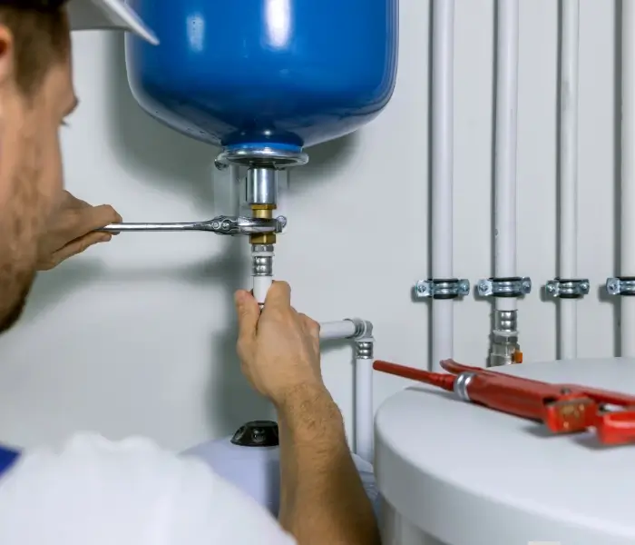800x600 Plumber fixing water treatment system component