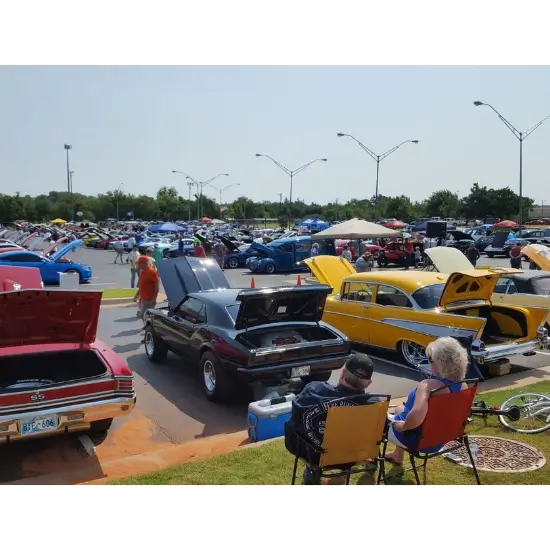 Western Days classic car show in Mustang, OK with open hoods.