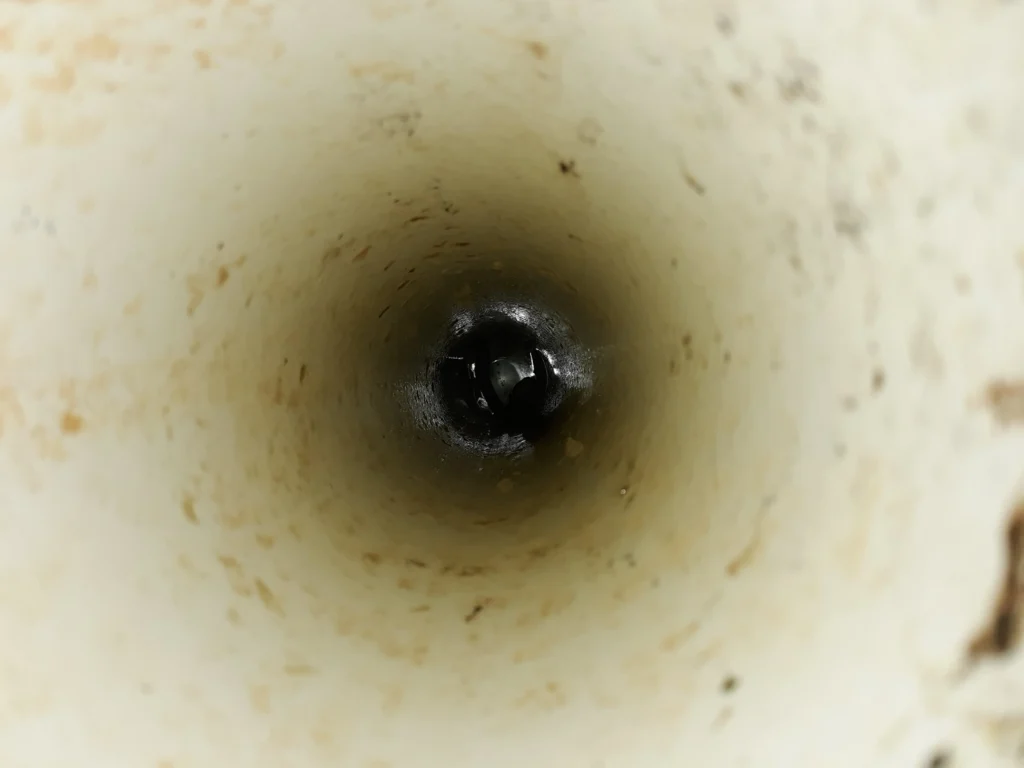 Inside view of a narrow, dirty pipe