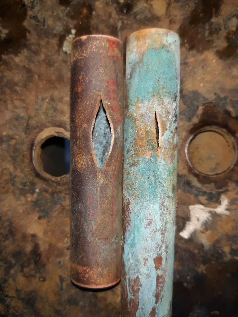 Rusty metal pipes with corrosion damage